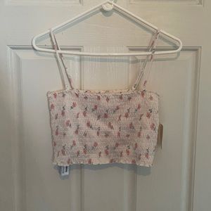 Straight cut cream crop top with faded designs